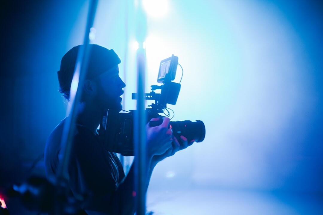 Camera operator framing a shot on a film set